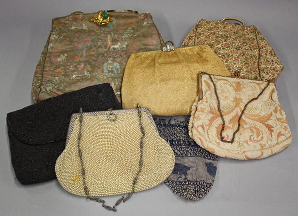 Group of purses and a fan: (lot of 8) Vintage purses, five with studded or jeweled reticules; together with a Victorian black lace fan featuring a hand-painted musical and putti scene