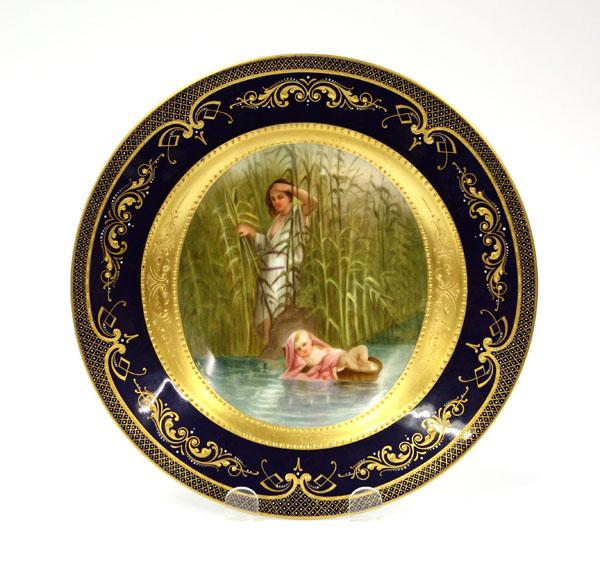 Royal Vienna Cabinet Plate: Royal Vienna hand painted cabinet plate, having a cobalt border with gilt enamel accents, the central medallion depicting the infant Moses on the Nile, verso with an underglaze beehive mark, 9.5''dia,
