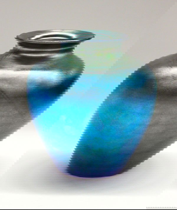 Steuben Aurene vase: Steuben art glass vase, shouldered form in Blue Aurene glass, with a long diagonal swirl from base to lip, signed Steuben, 8.25''h x 8''w