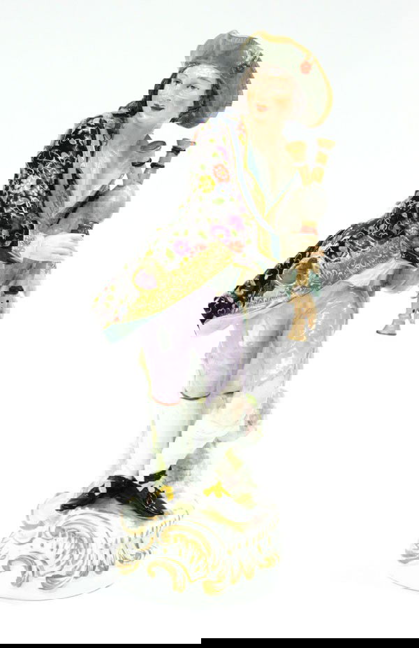 Meissen Pied Piper figural group: Meissen ''Pied Piper'' figural group, depicting a gentleman in colorful dress bearing his woodwind, rising on a naturalistic base, underside with blue cross swords and impressed mark 20, 12.5''h