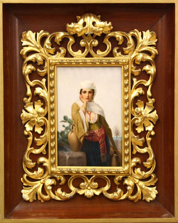 KPM Porcelain plaque: Framed hand painted KPM porcelain plaque, depicting Rebecca gazing afar, and bearing an amphora, retains original frame (loss to crest) set within a later mahogany cove moulding, verso with KPM scepte