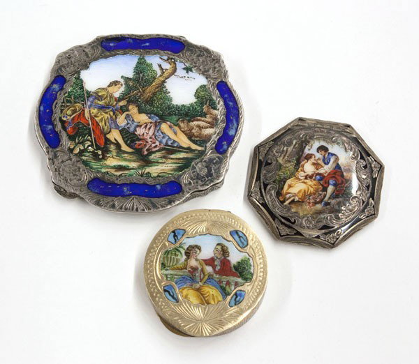 Sterling enamel compacts: (lot of 3) Sterling enamel compacts one with handpainted central genre scene having an inset lapis border and allover chased decoration, one Austrian pill box with handpainted central genre scene and 