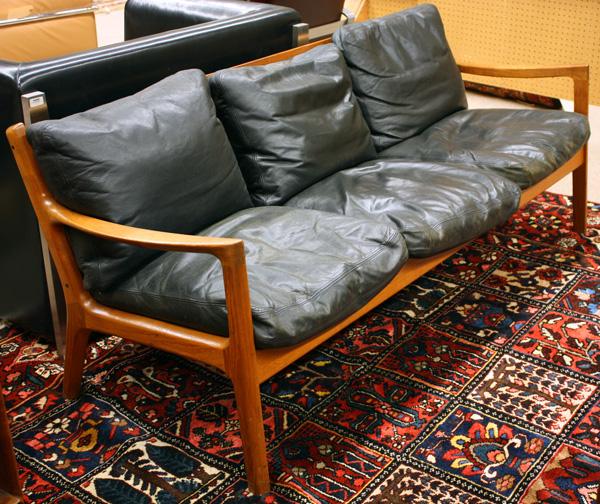 France & Son Danish teak sofa by Ole Wanscher: Ole Wanscher (1903-1985), Danish teak sofa, designed for France and Sons, in Conjunction with A.J. Version, circa 1960, teak frame, black leather down filled cushions, 28''h x 71.5''w x 26''d