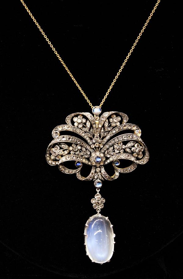 Moonstone diamond necklace yellow gold silver: Diamond and moonstone pendant necklace; mounted in silver over 15k yellow gold, set with (1) oval opal and (7) round moonstones weighing in total 16.62 cts and (214) full cut diamonds weighing 2.22 ct