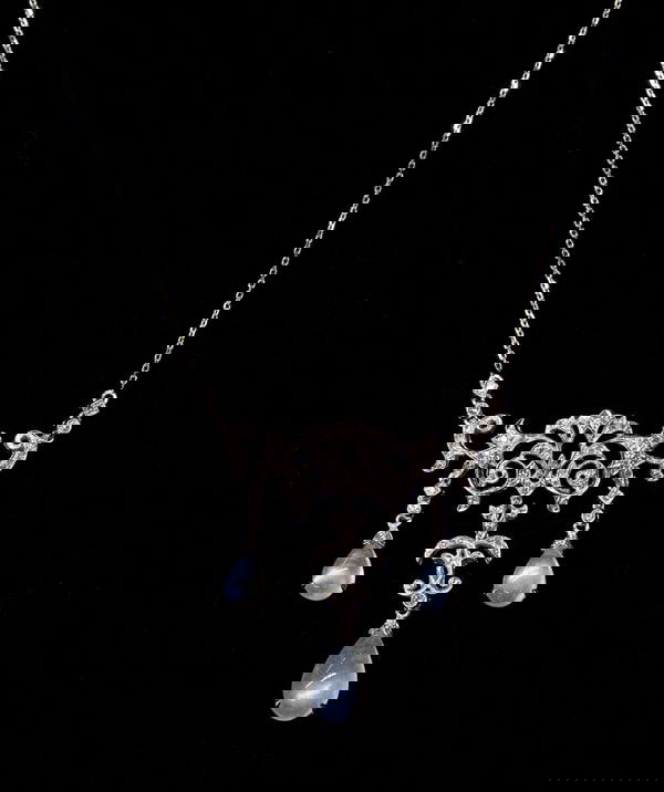 Moonstone diamond necklace white gold: Diamond and moonstone pendant necklace; mounted in 18k white gold, set with (3) moonstones weighing 4.90 cts and (77) old cut diamonds weighing 0.44 ct. Necklace length 16''