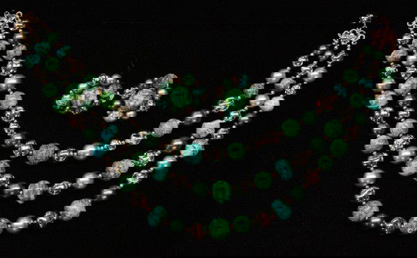 Schiaparelli fashion jewelry: (lot of 7) Schiaparelli fashion jewelry pieces including; gold tone horseshoe necklace and earring set decorated with sapphire blue and faux moonstone cabochon rhinestones, gold tone pin set with sapp