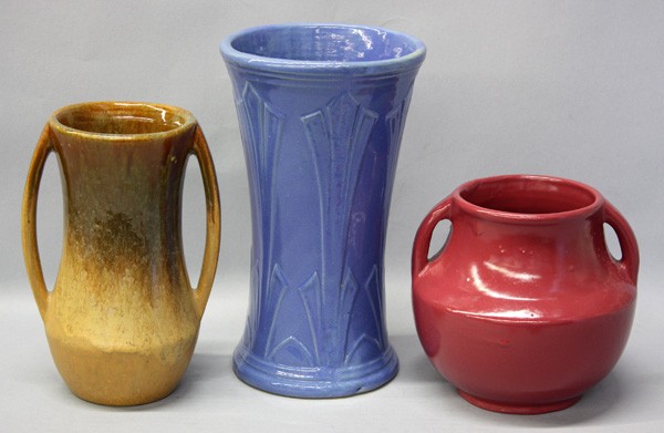 Arts and Crafts pottery: (Lot of 3) Arts and Crafts pottery, (2) Zane Pottery vases, including burgendy vase with two handles, 6.25''h x 7''w, a brown glazed two handled vase, 8.25''h x 6''w, and a blue vase, 10''h x 5.75''w