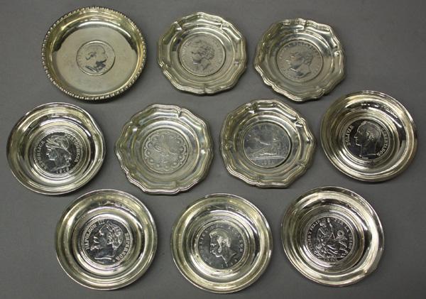 World mounted silver coins: (Lot of 10) World mounted silver coins, including Spanish Pesetas, 1870, 1892, Portugese 1916 Escudo, French 1867 5 Franc Napoleon III, India King and Emperor Edward VII 1903 1 Rupee, Ecuador 1944 .72