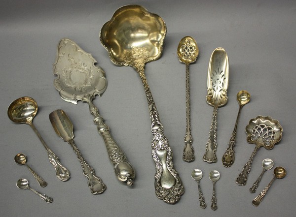 Sterling serving flatware: (Lot of 14) Sterling serving flatware, including (6) salt spoons, cake server, pickle spoon with pierced work and gold washed bowl, marrow spoon, (3) ladles, largest 12.5''h x 4.25''w, (2) pierced ser