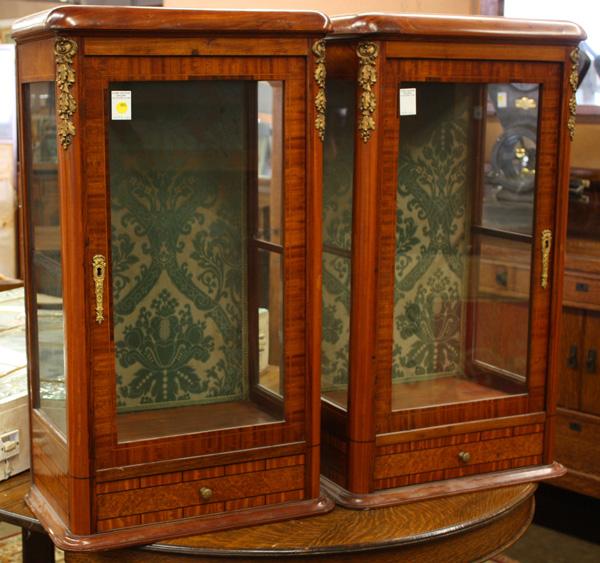 Pair of French inlaid single door vitrines: Pair of French inlaid single door vitrines, the glass door centered in an inlaid case with string and burl veneer marquetry, rising on a molded base, (originally part of a super structure) 34.5''h x 2
