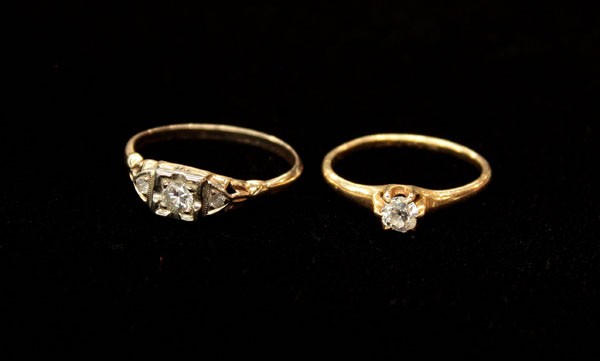 Dimaond rings white yellow gold: Two diamond rings; one solitaire engagement ring mounted in 18k yellow gold, set with a 0.25 ct diamond. Total ring weight 1.8 grams. Ring size 5.75 and one three stone ring mounted in 14k yellow and 