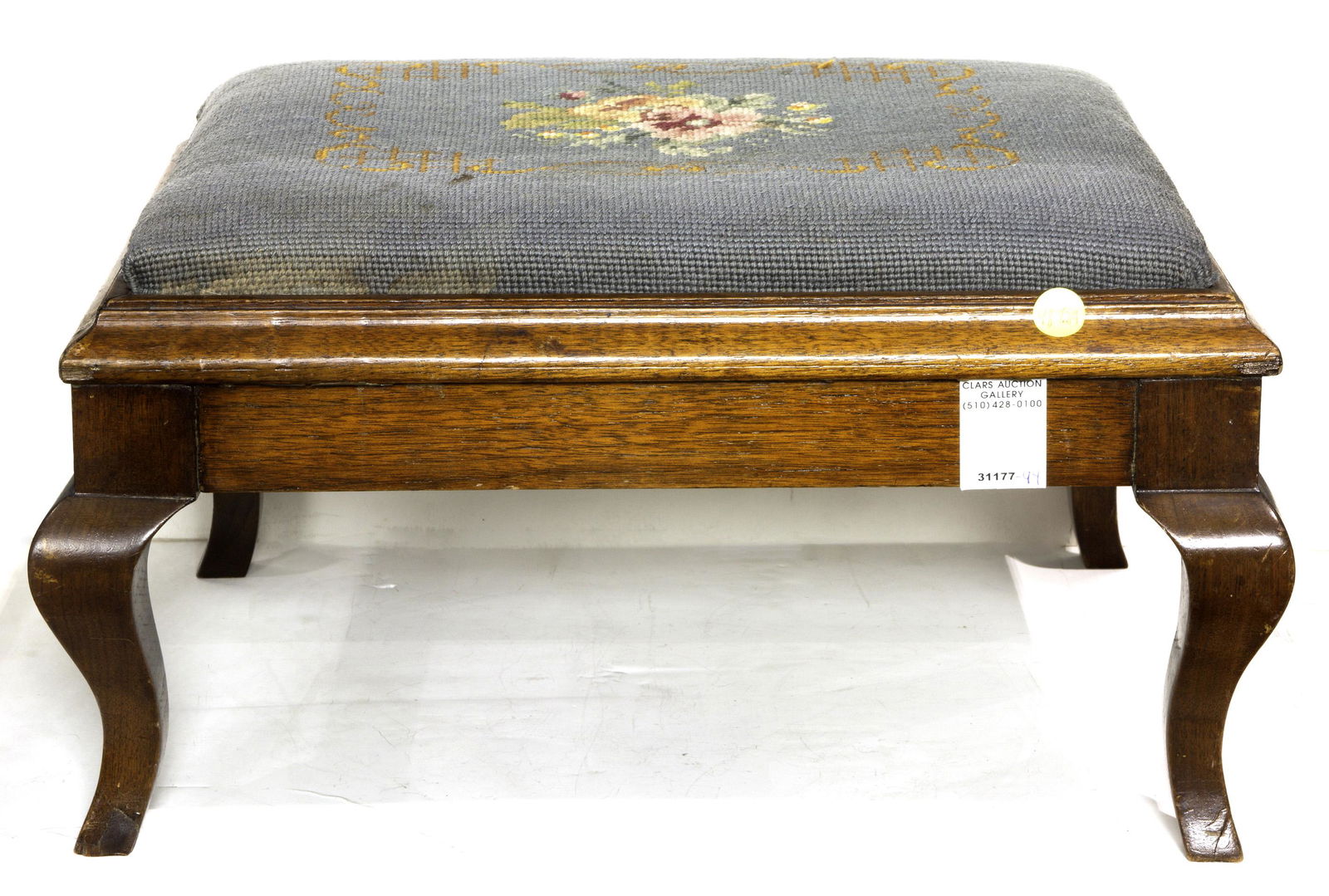 Needlepoint upholstered footstool (1 of 1)