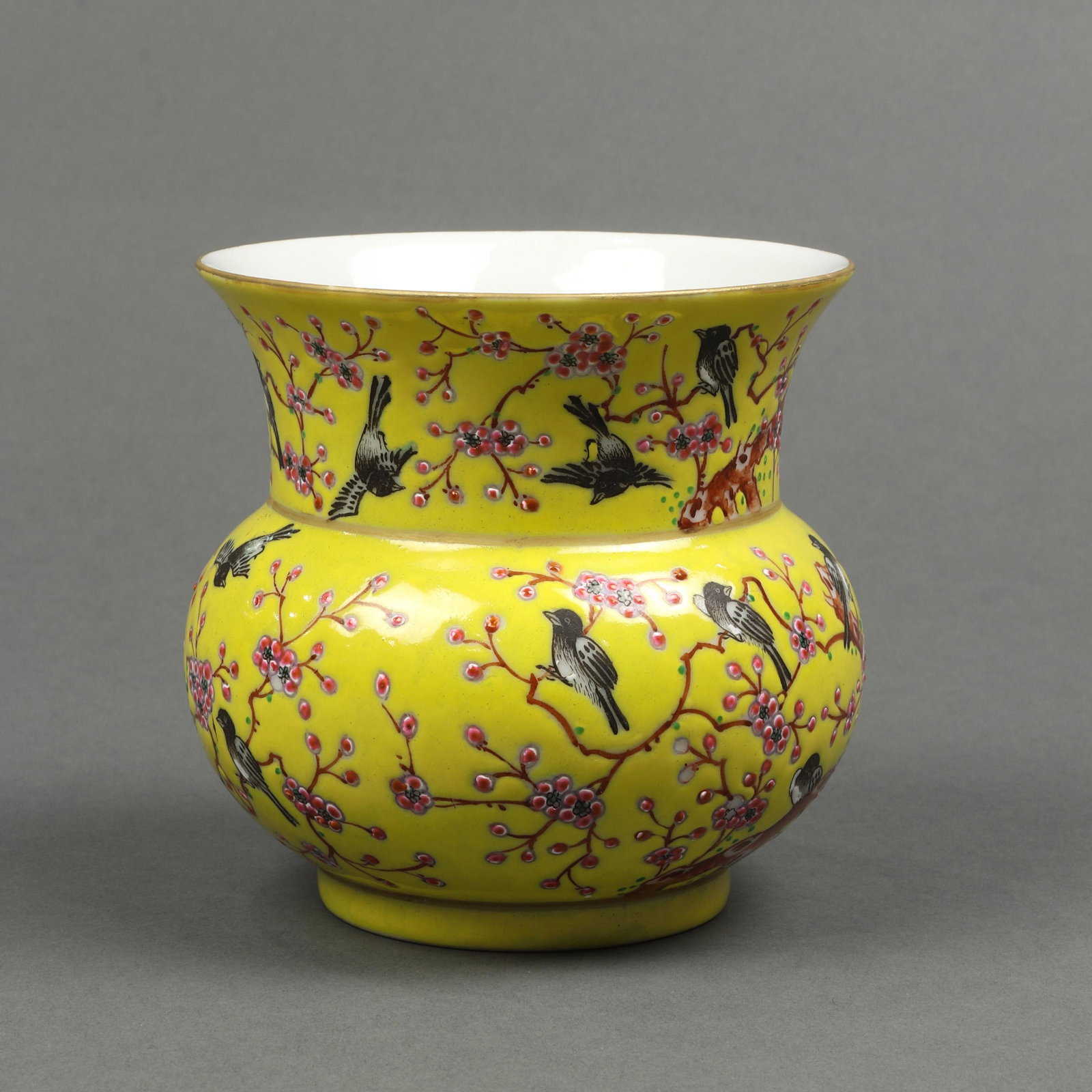 Chinese famille rose yellow ground spittoon zadou: Chinese famille rose yellow ground spittoon zadou, the body featuring magpies perching on prunus trees, all against a mustard yellow ground, the recessed base bearing an iron red six character Xuanton