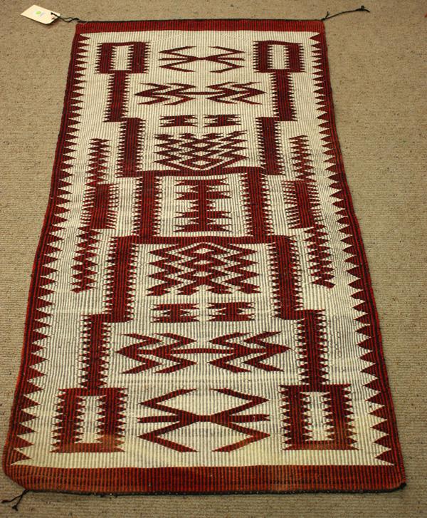 Navajo rugs: (lot of 5) Navajo rugs including a raised outlined storm pattern