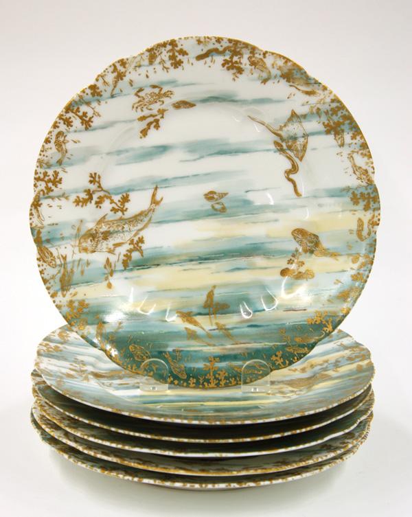Haviland Limoges porcelain seafood plates: (lot of 6) Haviland Limoges porcelain seafood plates, polychrome decorated on a white ground, having a turquoise marine background, with gilt decoration, including salmon, crab, eel, periwinkle mollus