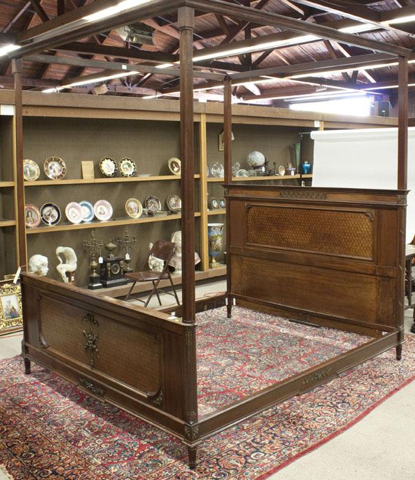 Louis XVI style mahogany inlaid bed: Louis XVI style mahogany inlaid bed circa 1890, the headboard with fluted quarter columns accented by the acanthus bronze mounts, the central panel with parquetry detail, the footboard with conforming