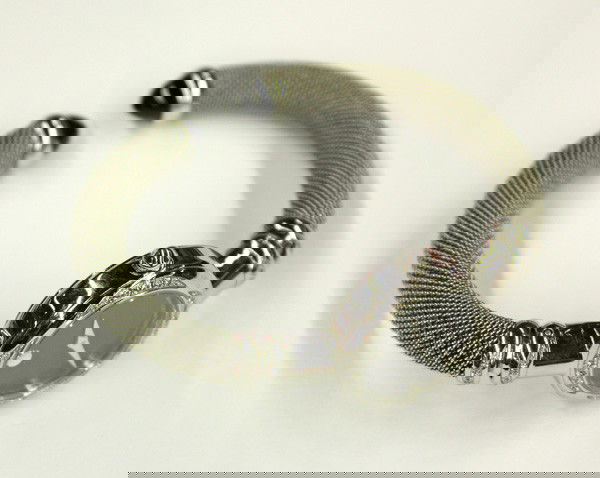 Lady's MOVADO wristwatch diamonds: Lady's MOVADO wristwatch; of stainless steel, having diamond accents weighing 0.20 ct and a flexible mesh bracelet. #7419877