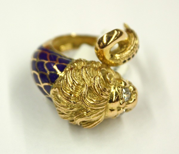Lion diamond enamel ring yellow gold: Diamond and enameled ''Lion'' ring; mounted in 18k yellow gold, set with blue enamel and (2) round cut diamond eye accents weighing 0.22 ct. Total ring weight 11.1 grams. Ring size 6.5