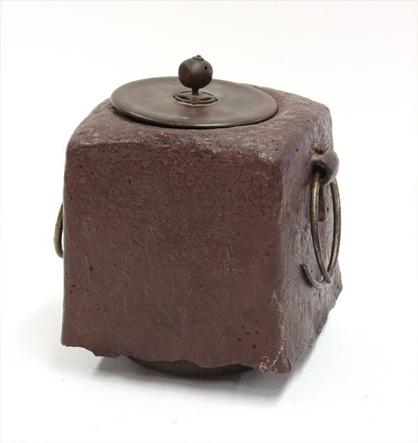 Japanese Iron Tea Ceremony Kettle (Kama): Japanese cast iron kettle, probably 20th century, of square section with a pair of loose ring and lug handles and flaring slightly to an irregular bottom edge partially obscuring a circular base, one 