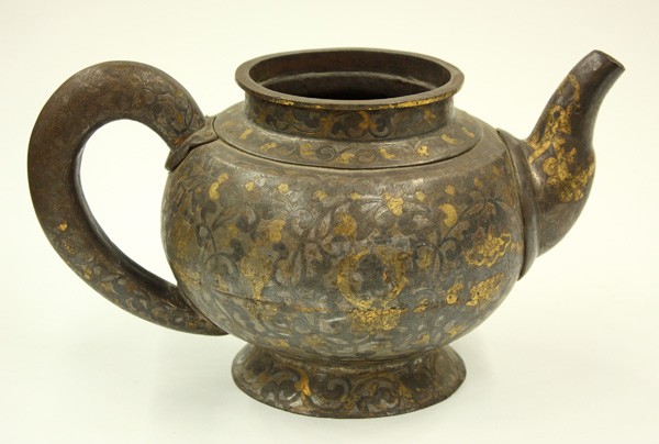 Sino-Tibetan Iron Pouring Vessel: Sino-Tibetan iron pouring vessel with silver and gilt accents, Qing dynasty, the ovoid body decorated with the 'Eight Precious Buddhist Emblems' picked out in gilt on a dense ground of flowering lotus