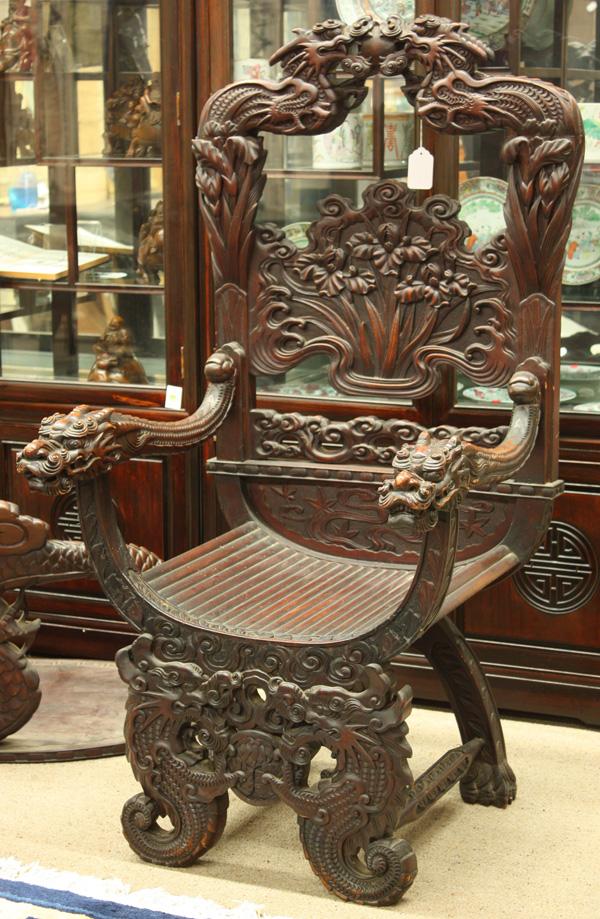 Japanese Export Chair, Iris: Japanese large export wooden chair, the throne-like back majestically formed by a pair of three dimensional dragons contesting a sacred jewel, all above a shaped back splat carved in relief with an ir