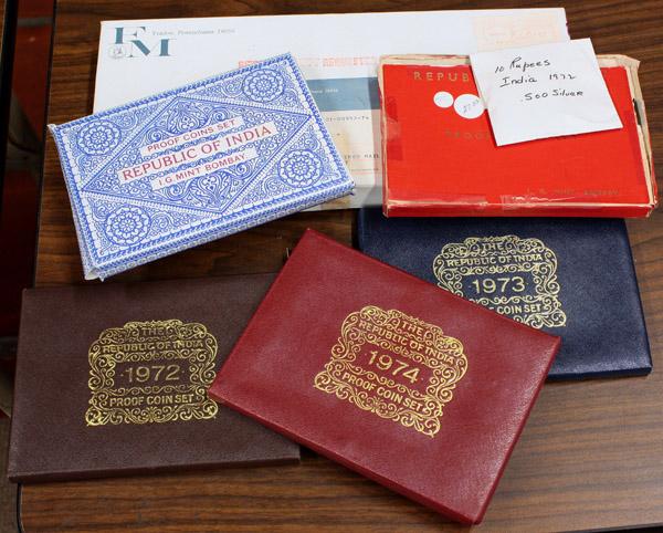 Republic of India Proof Sets: (lot of 7) Republic of Tunisia and India sets and an individual Indian coin. Lot includes a 1969 Republic of Tunisia silver coins set, five Republic of India sets dated 1970, 1971, 1972, 1973, 1974 an