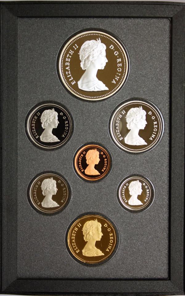 Canadianproof coin sets silver bronze copper: (Lot of 11) Royal Canadian Mint proof coin sets; dated 1973, 1981-1990. Each set having 7 coins, one is a silver dollar. Total of 77 coins and 11 silver dollars. Each having a case and box