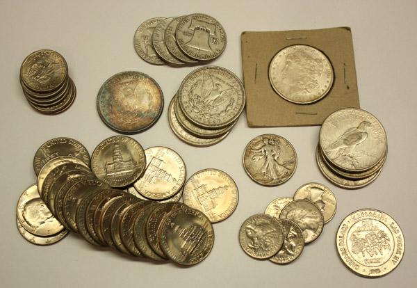 us coins silver dollars quarters half: Collection of US coins and a game token, including; (14) Trade, Morgan, Peace and Anthony silver dollars, dated 1885, 1889, 1921-1923 & 1979, (5) Walking Liberty and Franklin silver half dollars, date