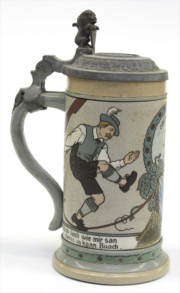 German Meetlach beer stein: Mettlach lidded stein having an incised and polychrome decorated body depicting a dancing couple centered with an Ober-Bayern medallion, marked and numbered 3142, circa 1880-1915, 8.5''h