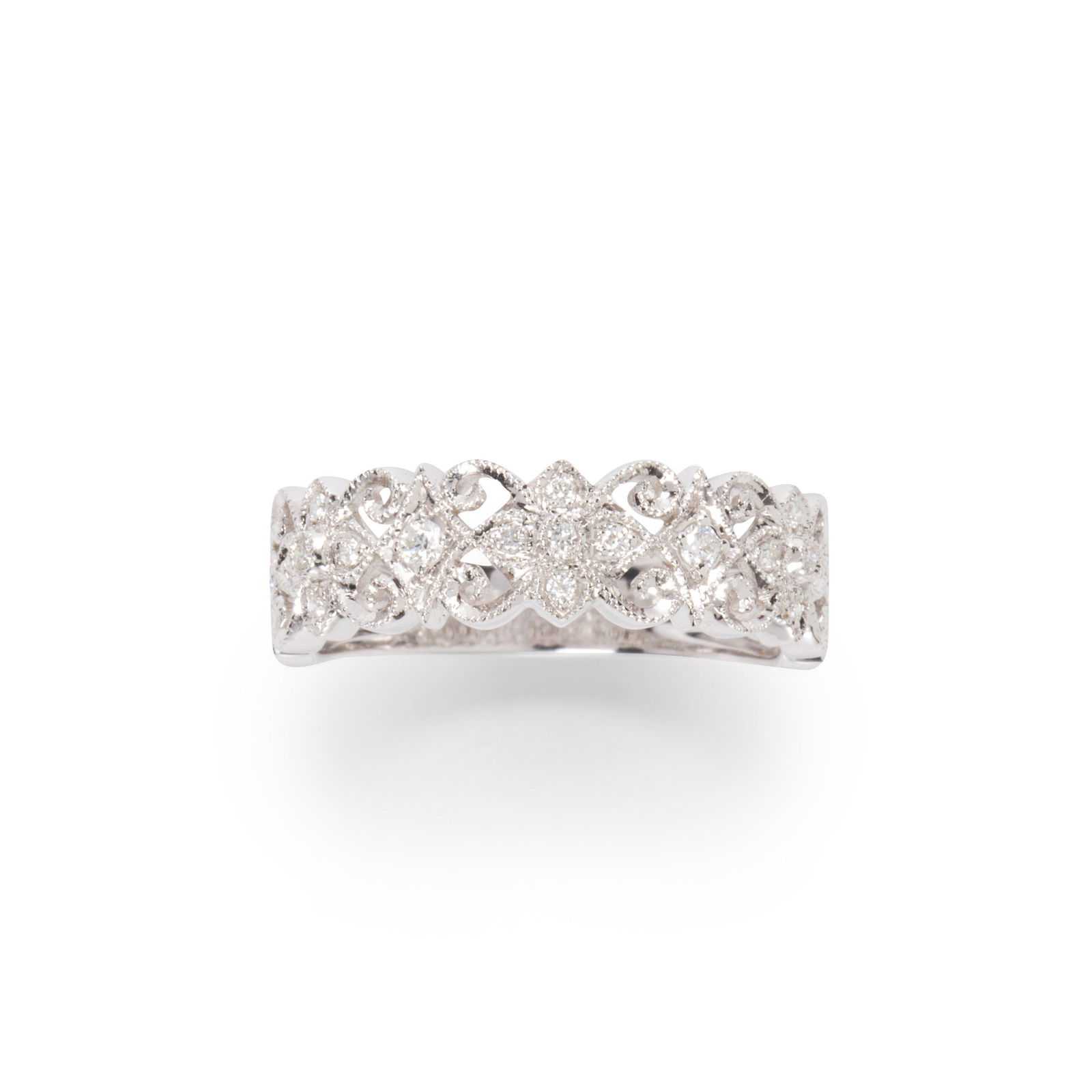 A diamond and fourteen karat white gold ring: A diamond and fourteen karat white gold ringa millegrained floriform design, set with round brilliant-cut diamonds.Property from the Estate of Sally Kathleen Scholz, a Monterey Bay Jeweler 2.1 dwt; si