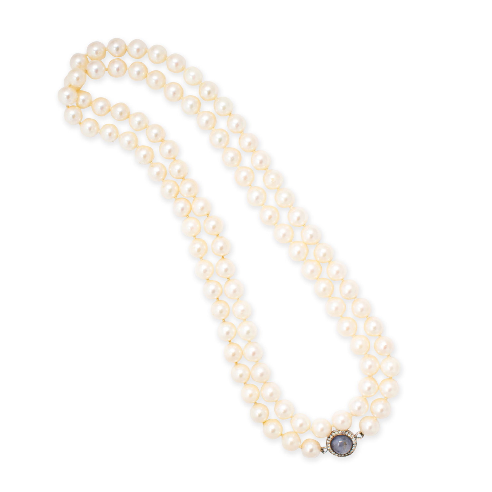 A cultured pearl, star sapphire and diamond necklace: A cultured pearl, star sapphire and diamond necklace a strand of ninety-four pearls, measuring approximately 8.50 mm in diameter, joined by a circular cabochon sapphire, measuring approximately 9.00 m