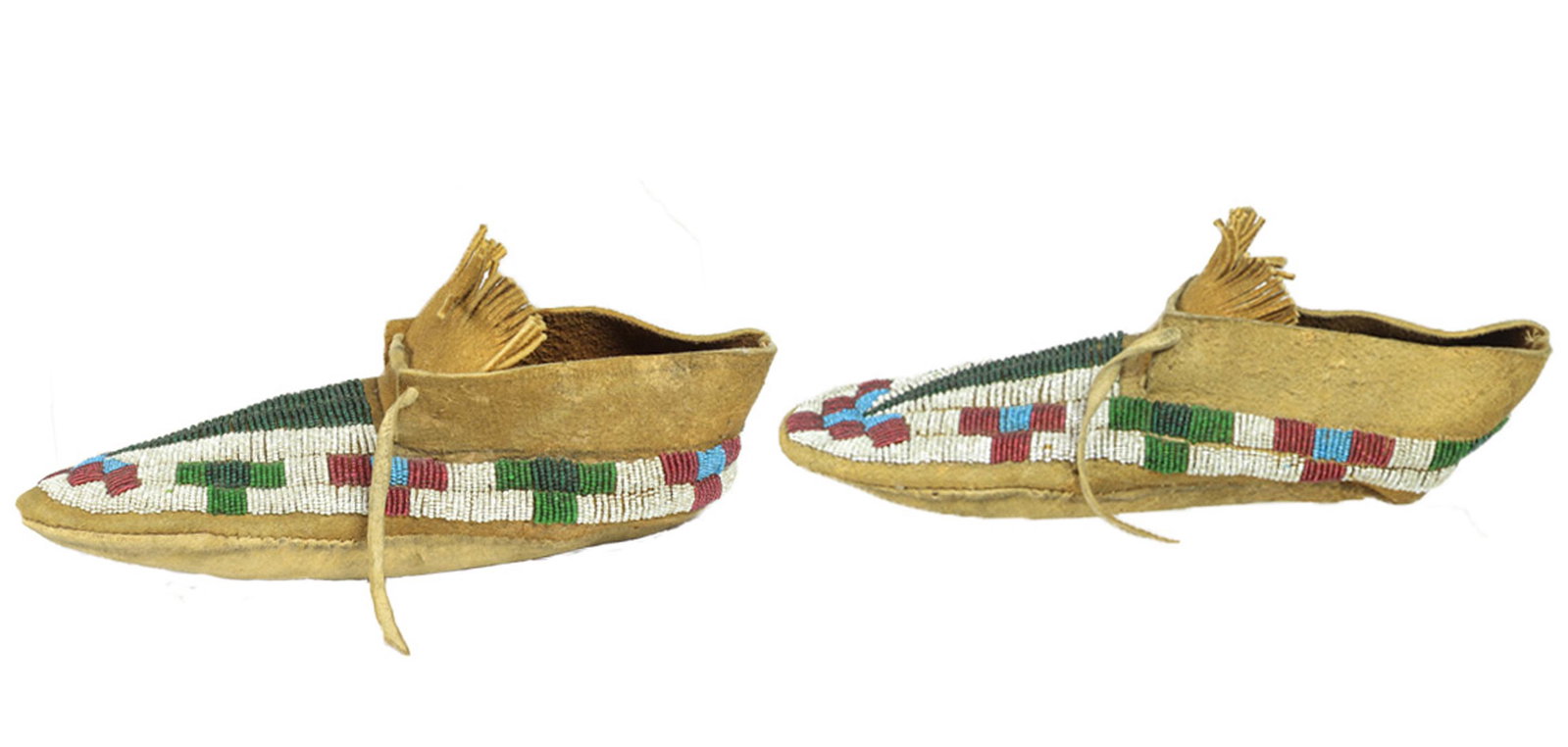 A pair of Northern Plains beaded moccasins: A pair of Northern Plains beaded moccasins, 10.25"l Provenance: Lew Sarett (1888 - 1954), American poet and professor