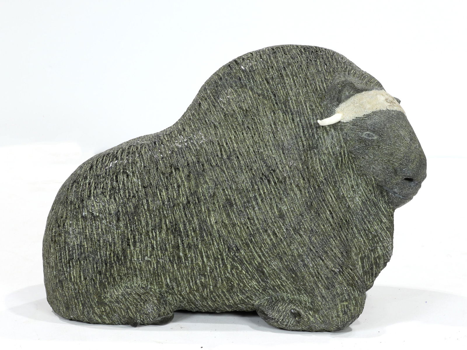 An Inuit soapstone carving of a muskox, indistinct (1 of 5)