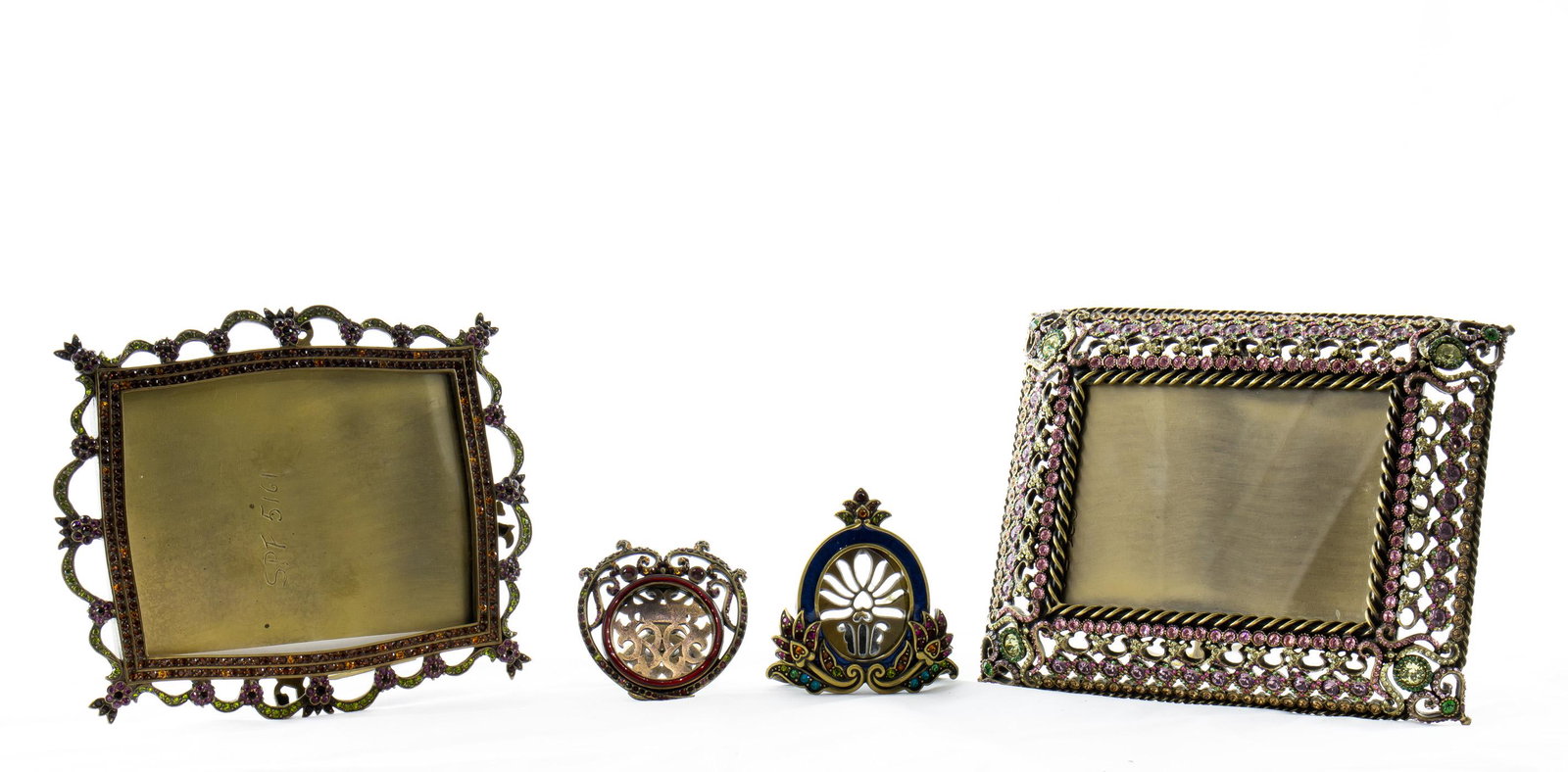 Lot of 4 Jay Strongwater enamel and Swarovski crystal: A (lot of 4) Jay Strongwater enamel and Swarovski crystal frames, consisting of pierced cushion frame for 4.5" x 3.25" image, model SPF 5100; frame decorated with flower-heads and swags for 4.75" x 3.