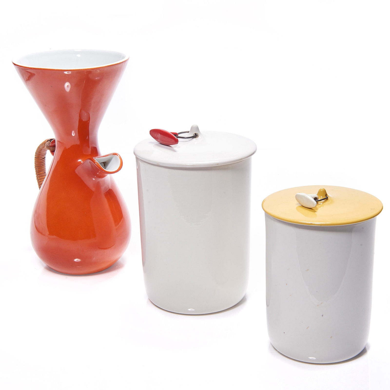 (lot of 3) Modern ceramics group: (lot of 3) Modern ceramics group, consisting of (2) Lagardo Tackett canisters, one with a yellow lid, the other with a red handle, and a Kenji Fujita for Freeman Lederman coffee maker, 10.5"h