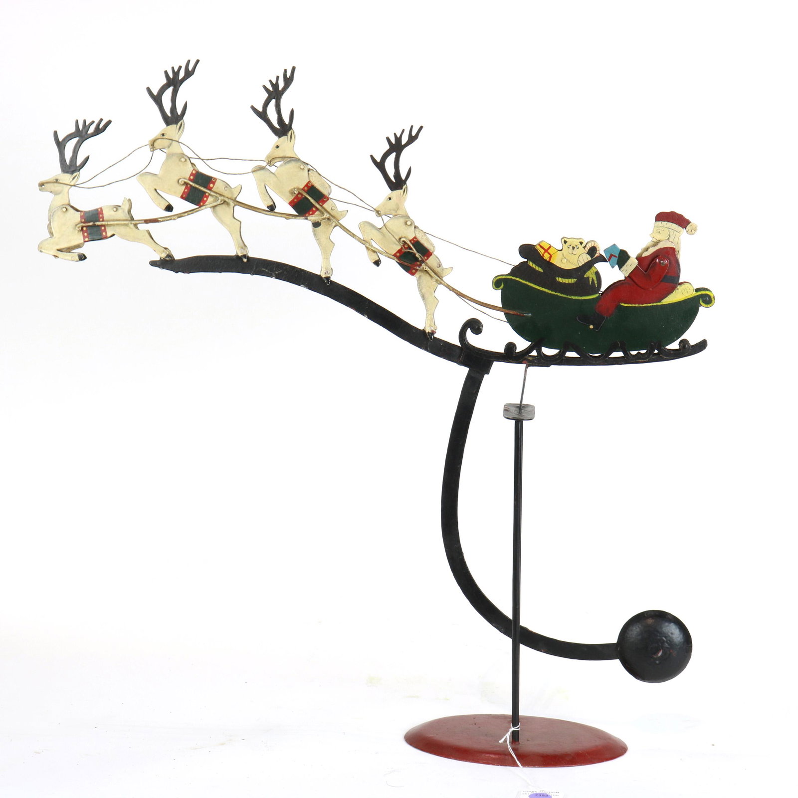 Folk ark painted metal articulated rocking Christmas: Folk ark painted metal articulated rocking Christmas toy of Santa and his reindeer with counter balance pendulum, approximately 24"h x 24"w