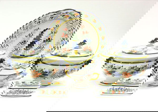 Quimper Henriot earthenware pottery: (Lot of 6) Quimper Henriot pottery, decorated with Breton male and female figures, includes a charger, two lidded tureens, two boxes with lids, and a sauce boat, largest 13''