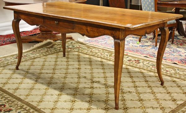French Provincial style harvest table: French Provincial style cherry harvest table, the rectangular top above a single drawer case with an incised and scalloped apron and rising on cabriole legs, 31''h x 75''l x 35''d