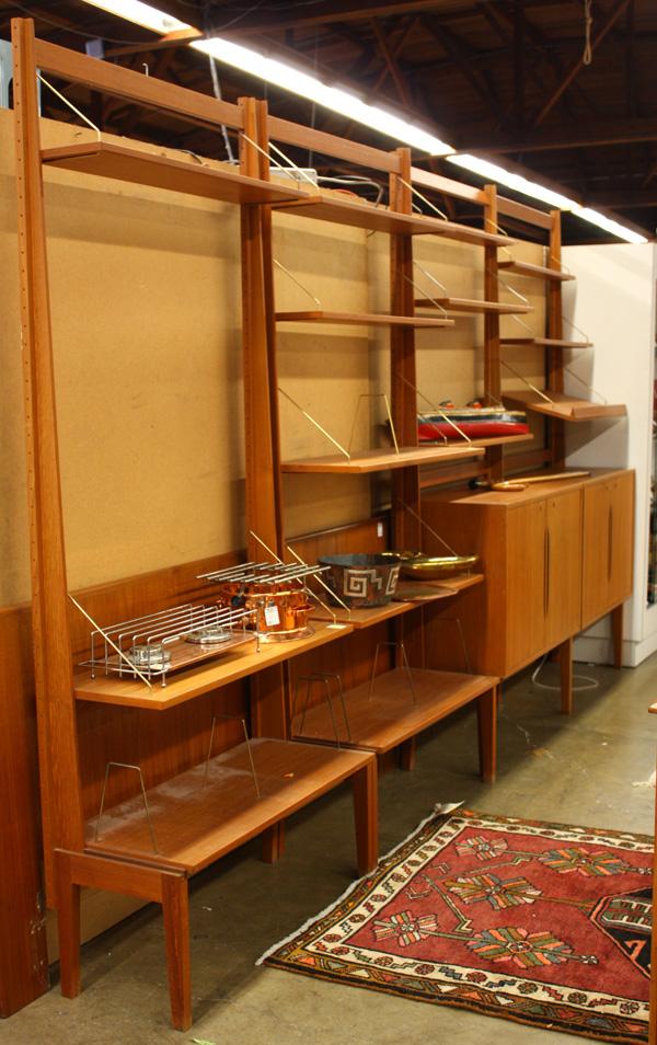 Torbjorn Afdal for Bruksbo, teak wall unit: (lot of 3) Torbj÷rn Afdal for Bruksbo, Norwegian teak free-standing wall unit, circa 1960, four components, each with adjustable shelves, two with cabinets, seven uprights, label attached inside cabi