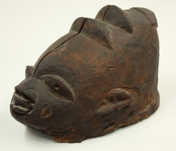 Gelede mask and New Guinea face plaque: (lot of 2) Gelede mask, Yoruba, Nigeria, old and used (has crack); together with a decorative New Guinea face plaque