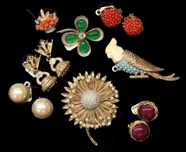 Nettie Rosenstein fashion jewelry: (lot of 8) Pieces of Nettie Rosenstein fashion jewelry including; a gold tone cockatoo brooch having a carved ivory colored head and pale blue bead adorned body, a shamrock pin, three pairs of globula
