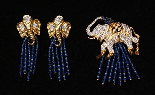 Elizabeth Taylor Collection fashion jewelry: (lot of 2) Elizabeth Taylor Elephant Walk Collection fashion jewelry, 1993, consisting of a gold toned brooch and pair of earrings with crystals and sapphire colored glass beads