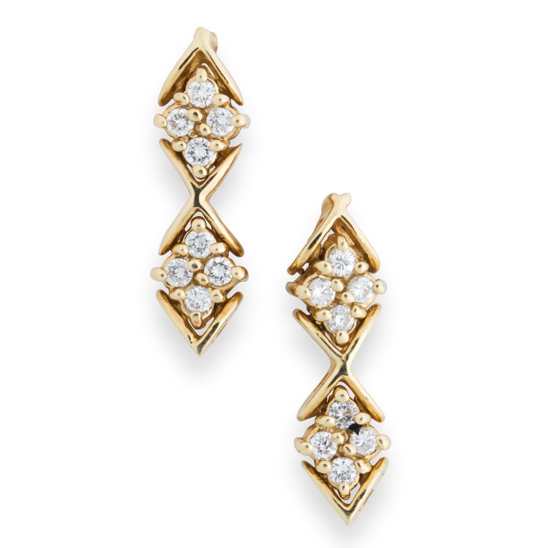 A pair of diamond and fourteen karat gold earrings: A pair of diamond and fourteen karat gold earringseach designed as articulated geometric links centered by round brilliant-cut diamond clusters. 3.1 dwt; length: 1 in