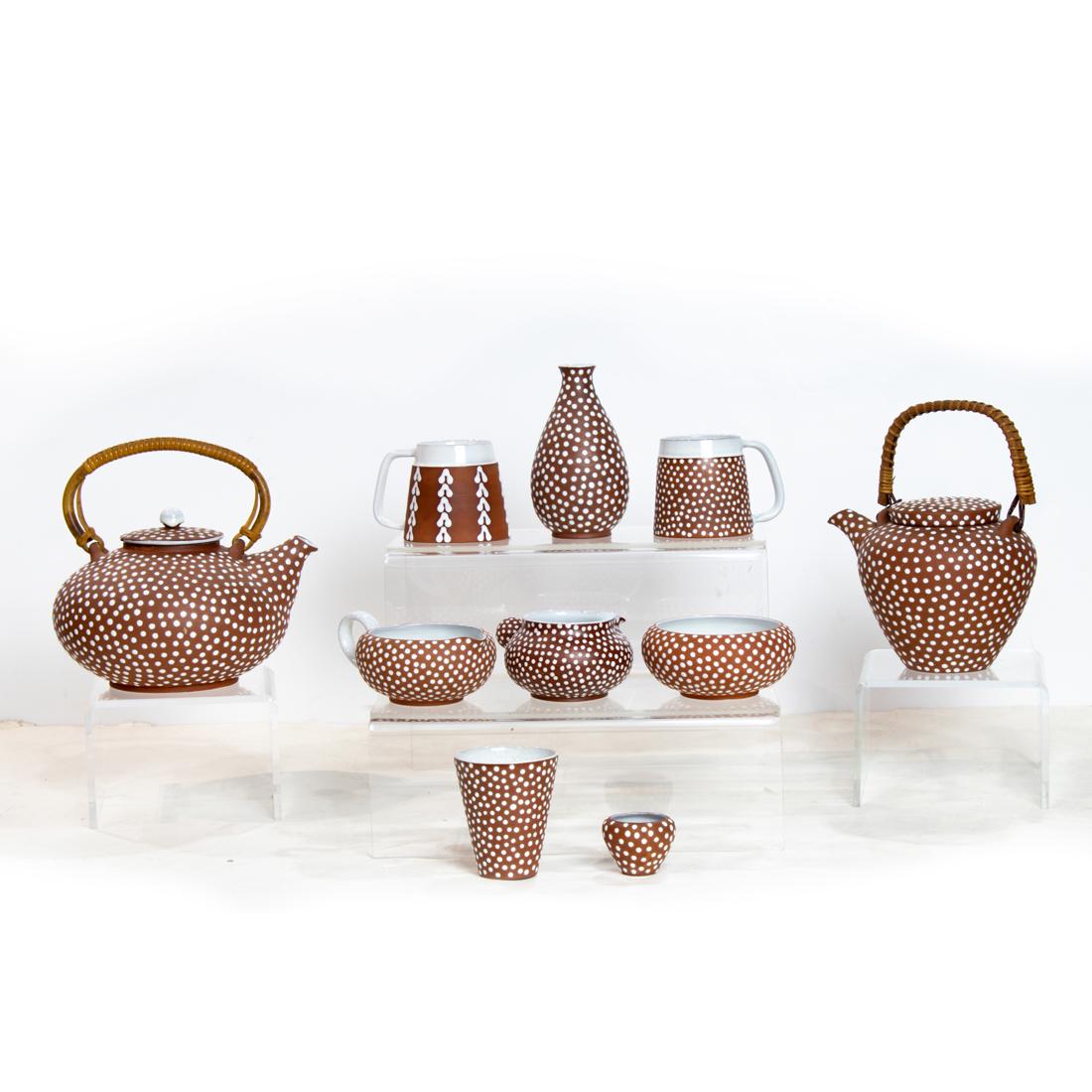 (lot of 19) Danish Zeuthen tea and coffee service: (lot of 19) Danish Zeuthen tea and coffee service, redware pottery, including a tea pot, a coffee pot, coffee cups, creamers, vases, etc.