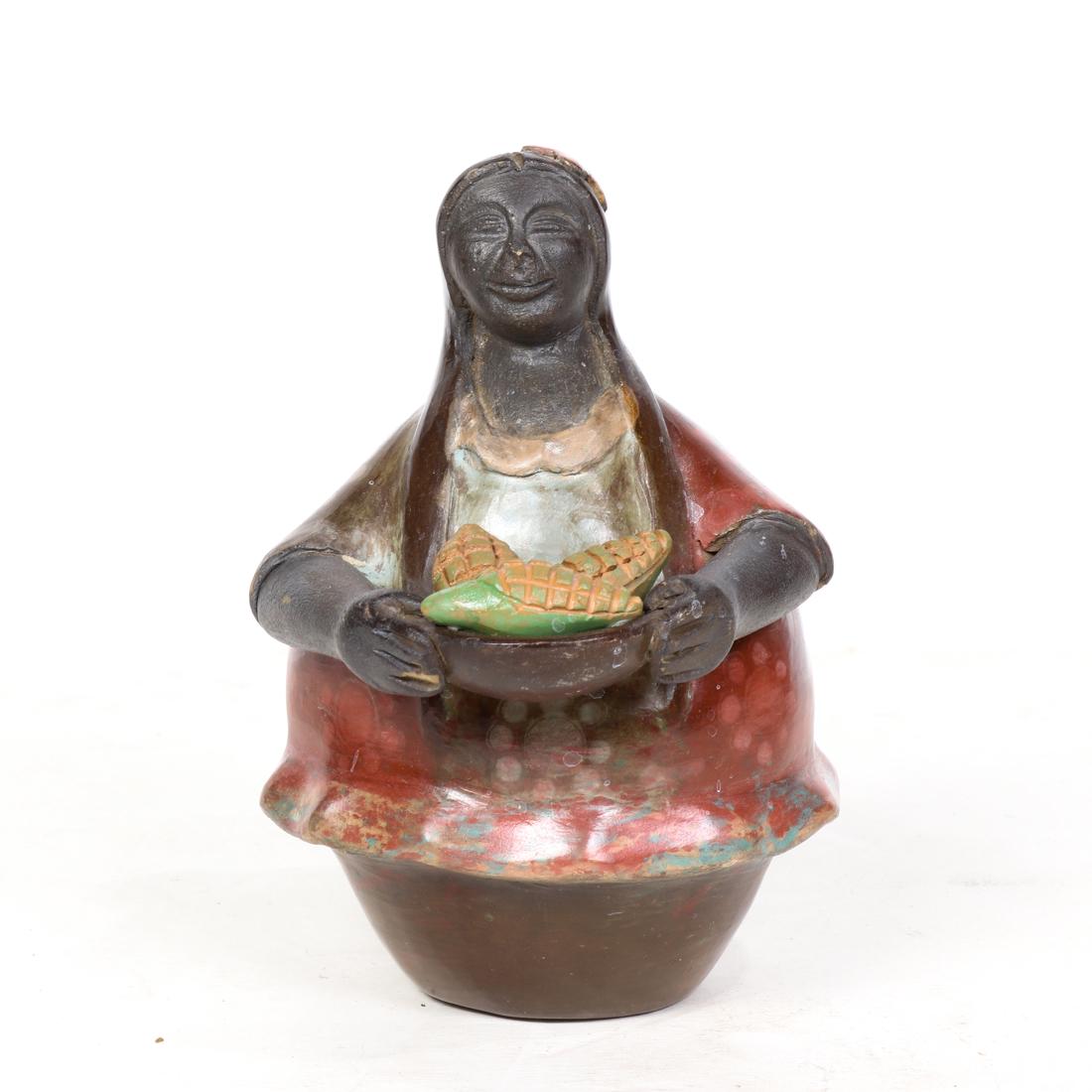 (lot of 2) Peruvian polychrome pottery figure of a: (lot of 2) Peruvian polychrome pottery figure of a woman, signed 'Jose Luis Marques, Chulu Cana, Peru', 6.25"h, together with a Mexican carved figure of a seal, 4"h x 5.5"w