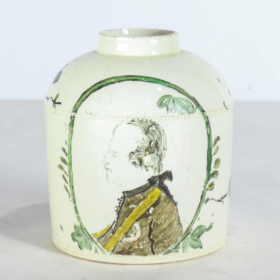 Staffordshire creamware tea canister: Staffordshire creamware tea canister, late 18th century, painted with portrait of George III and trailing flowers, unmarked, 3.75"h