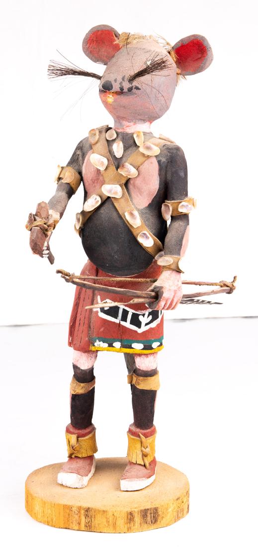 Field mouse kachina decorated with shells, probably: Field mouse kachina decorated with shells, probably Navajo, holding a bow and arrow in one hand, the other with stone axe 12.25"h