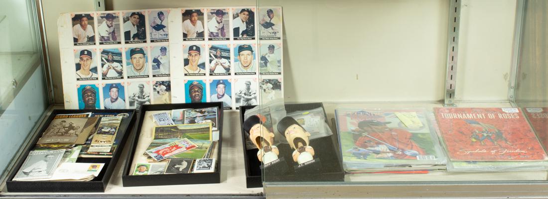 One shelf of sports memorabilia: One shelf of sports memorabilia, including Jeff Kent and J.T. Snow bobble heads, Remar Baking Co. sports cards including George Bamberger, Ralph Buxton, Berger Superbas, a Harvard Vs. Navy 1937 ticket