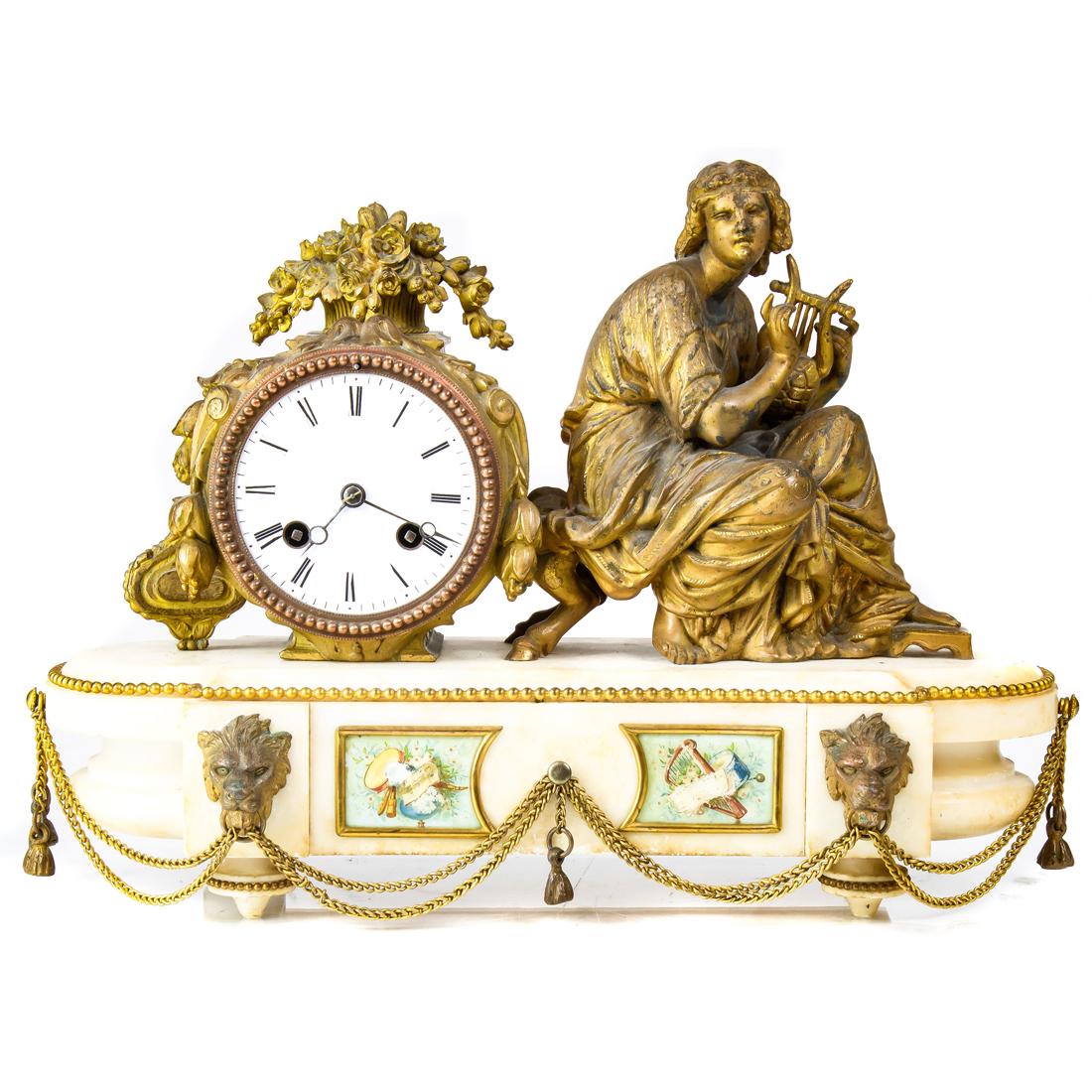Louis XVI style gilt metal marble figural mantel clock: Louis XVI style gilt metal, marble and paint decorated figural mantel clock, second half 19th century, the Roman numeral dial with time and strike movement with Japy Freres pastille, housed within a d