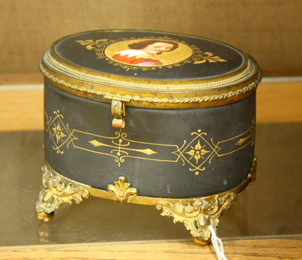 Antoine Van Dyck soft paste porcelain box: Soft paste porcelain oval box, circa 1890, the lid decorated with a portrait of Antoine Van Dyck, gilt metal mounts, raised on foliate feet, 4.25''h x 6''w x 4.5''
